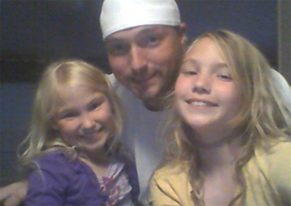Material Handler James Ballew with his daughters.